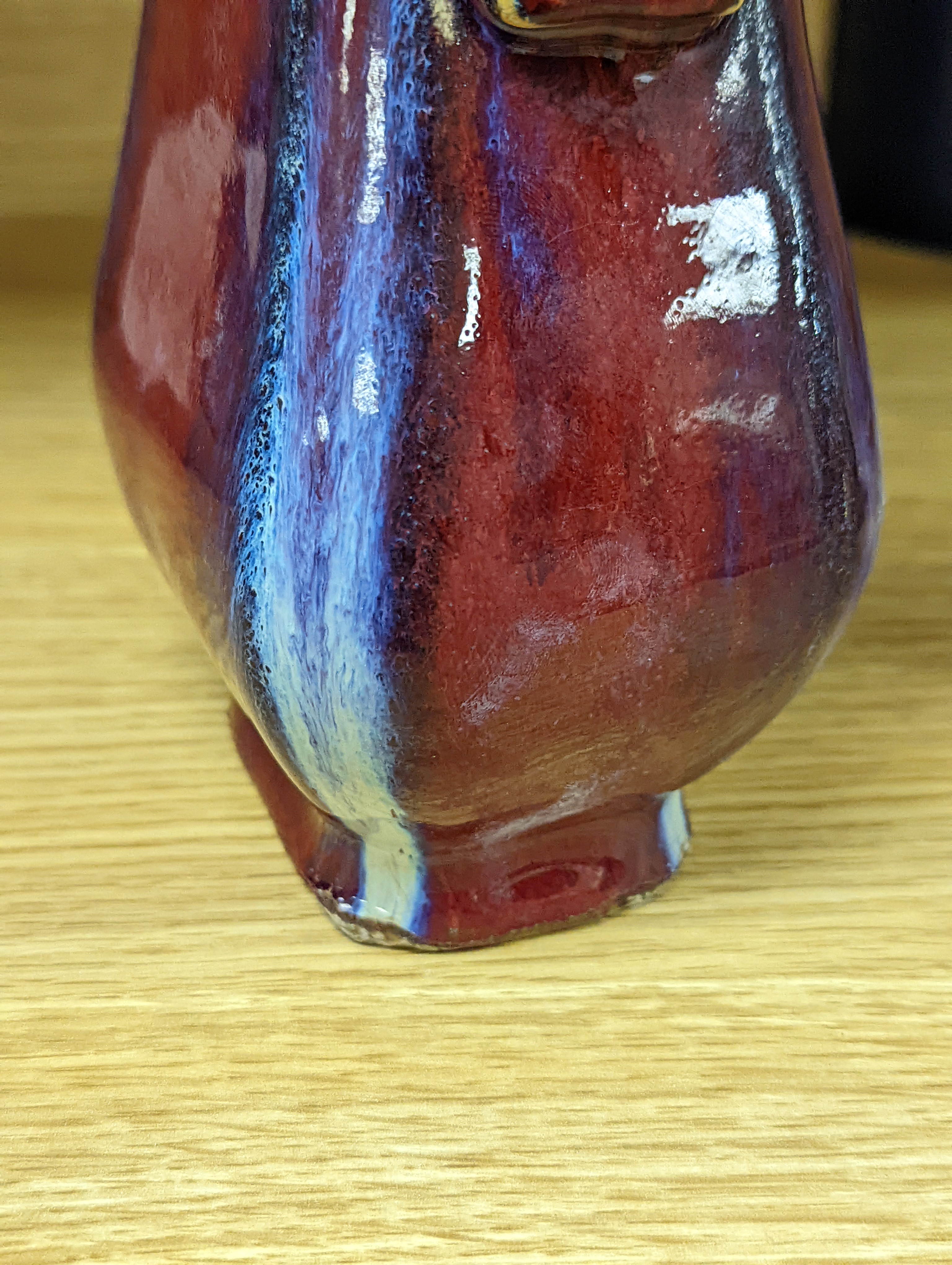 A Chinese sang de boeuf arrow vase 17cm